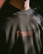 Tresor Records Orange Outline Logo on Faded Black Long Sleeve